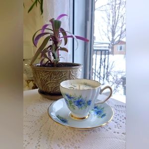 Candle in a pretty teacup with floral motifs